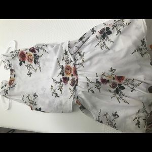 Boutique Romper with flowy front and open back